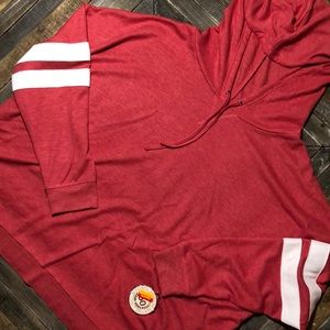 SO red, hooded athletic top.